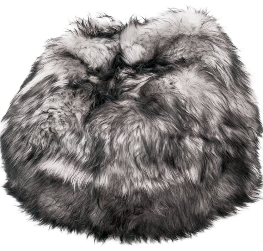 Long haired ivory Icelandic sheepskin bean bag with silver and black tips.
