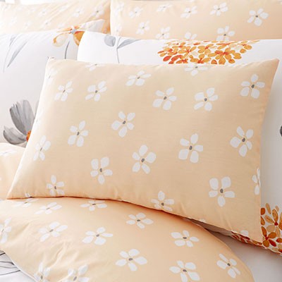 Orange floral boudoir cushion.