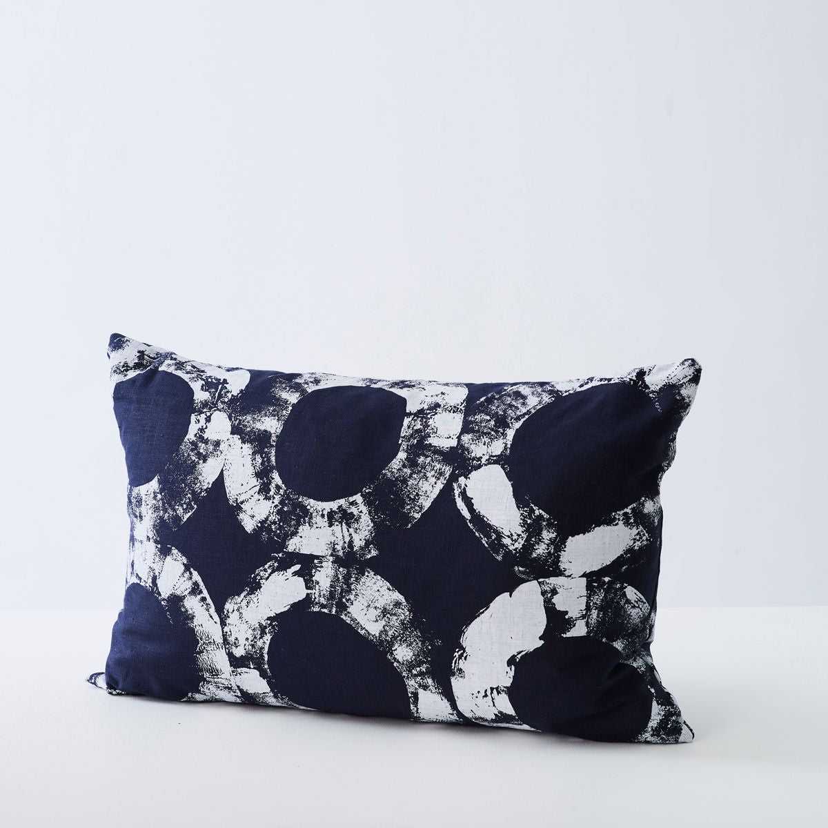 Handmade navy cushion with a circular pattern. Made in the UK.