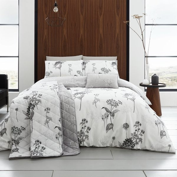Floral duvet cover set with grey shades on a neutral background.