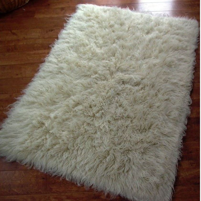 Genuine hand-made high 2000 gr/m2 density Flokati wool rug. Cream in colour.